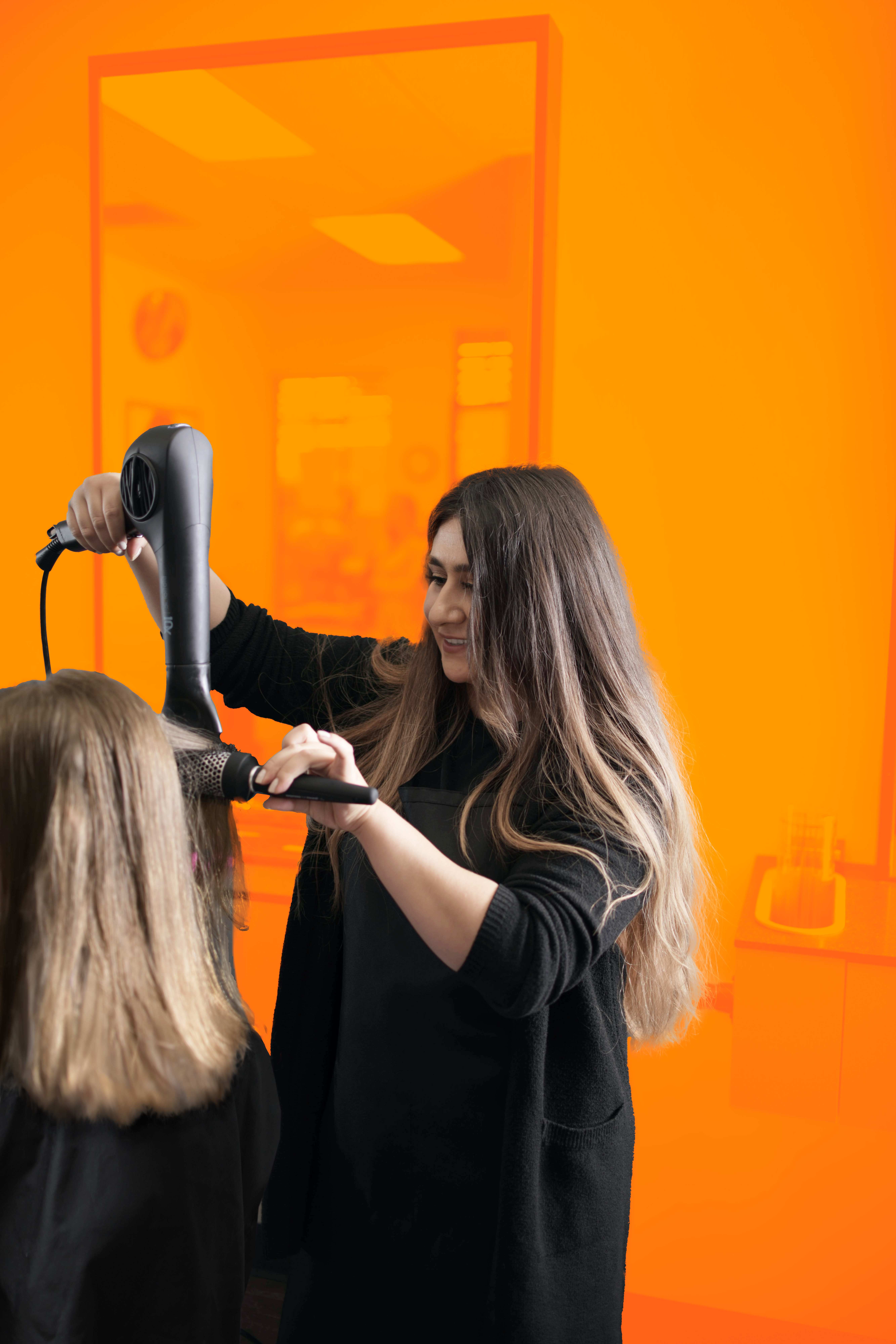 Professional hair stylist at work